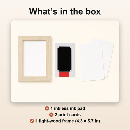 What's in the box: 1 inkless ink pad, 2 print cards, 1 light-wood frame